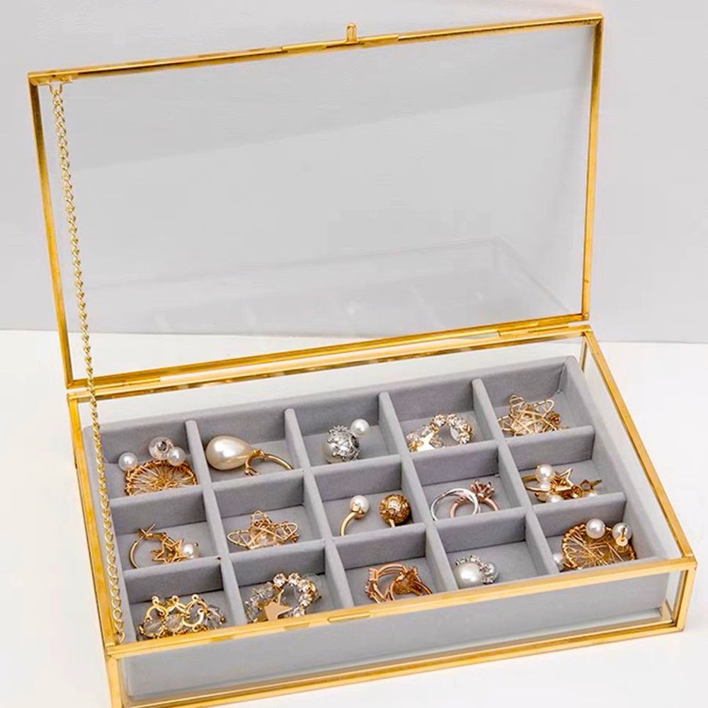 Brand new jewelry showcase. Including a 15 compartment velvet tray.